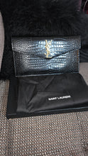 Load image into Gallery viewer, Preloved YSL Evelope Clutch Great condition- black with fold hardware.

